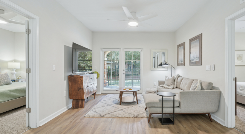 living room with a couch and a table and ample natural light