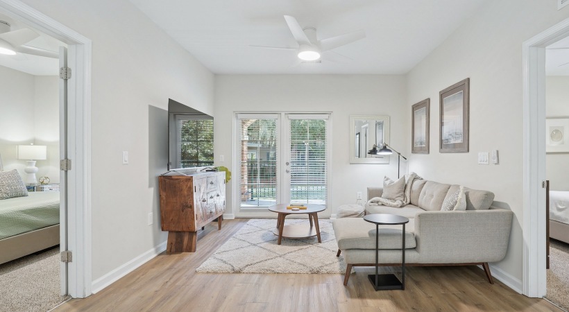 living room with a couch and a table and ample natural light