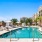pool with reclining seats and nearness to apartments