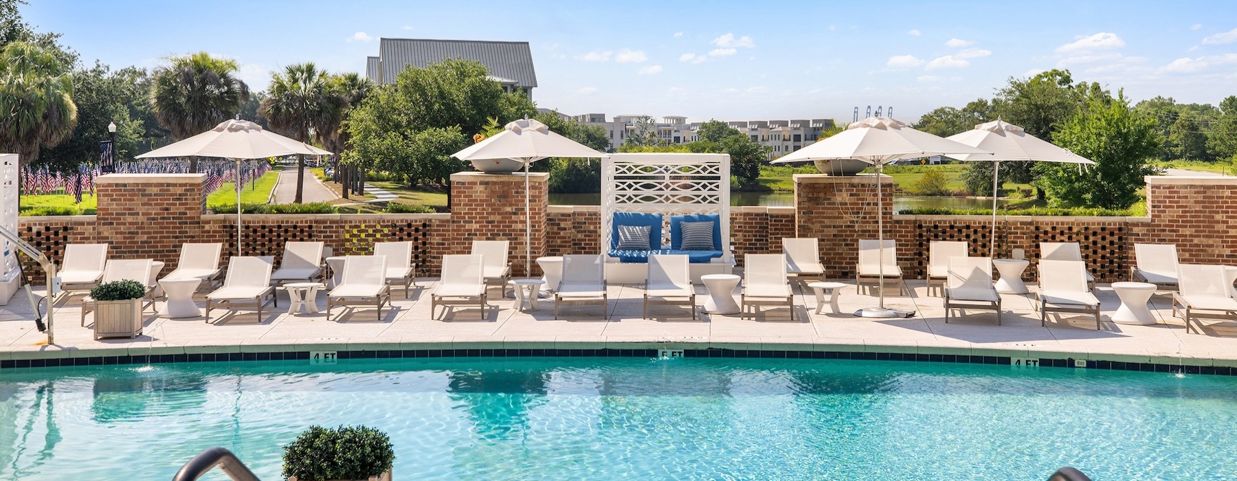 pool and reflections with reclining seats and modern stonework