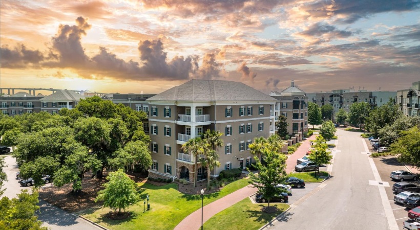 aerial view of pool and courtyard showing surrounding landscaping
