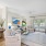 living room with ample natural lighting from large windows