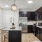 kitchen with an island, modern appliances and spacious counter-space