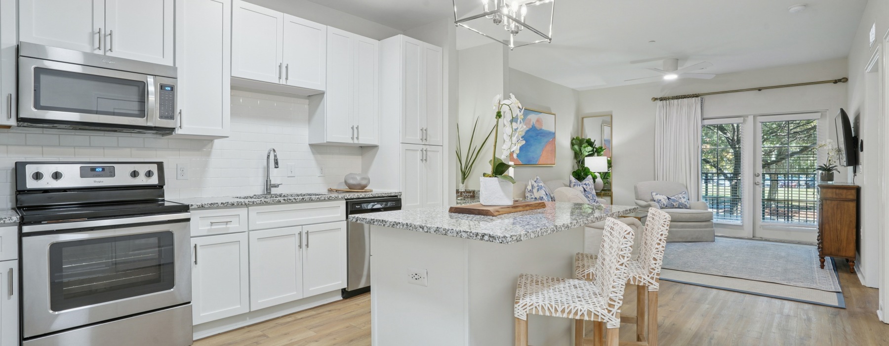 open living concept showing living room and kitchen combined with ample space for seating and modern living room decor